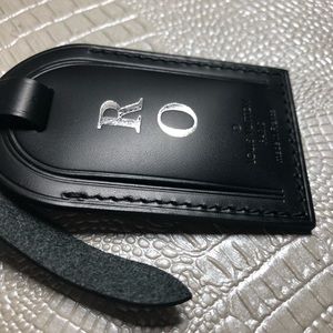 Louis Vuitton luggage tag. R O initials monogram